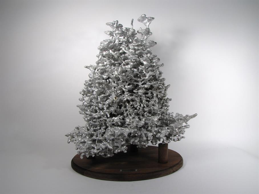 A very large metal fire ant colony cast.